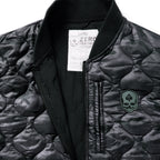 Woobie Vest (Last Chance) in black and gray camouflage with quilted insulation, ribbed collar, front zipper, and skull patch on the chest