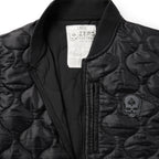 Woobie Vest (Last Chance), black quilted vest close-up with ribbed collar, front zipper, chest pocket, skull patch, and interior size label
