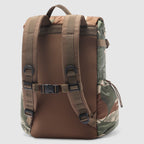 Woobie Backpack shown from the back with padded shoulder straps, chest buckle, top handle, brown body, and camouflage fabric on the sides and base