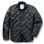 Woobie Shacket in black with quilted fabric, button front, collar, long sleeves, and a small skull patch on the chest against a white background