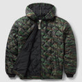 Woobie Zip Hoodie in green and black camouflage with quilted lining, drawstring hood, full zip front, front pockets, and ribbed cuffs and hem