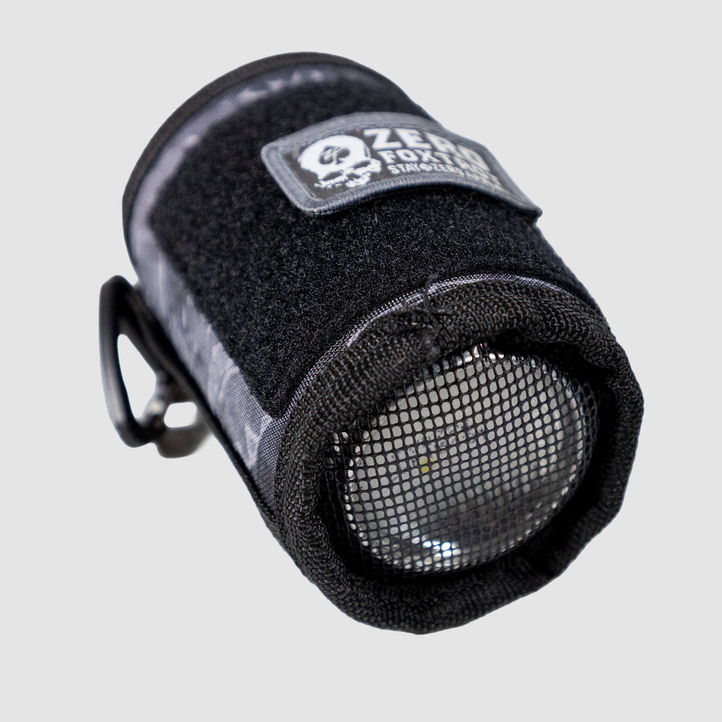 Close-up of a black Rations Drink Wrap with mesh end, designed to securely hold a bottle, featuring durable fabric and a Velcro strap for adjustable fastening.