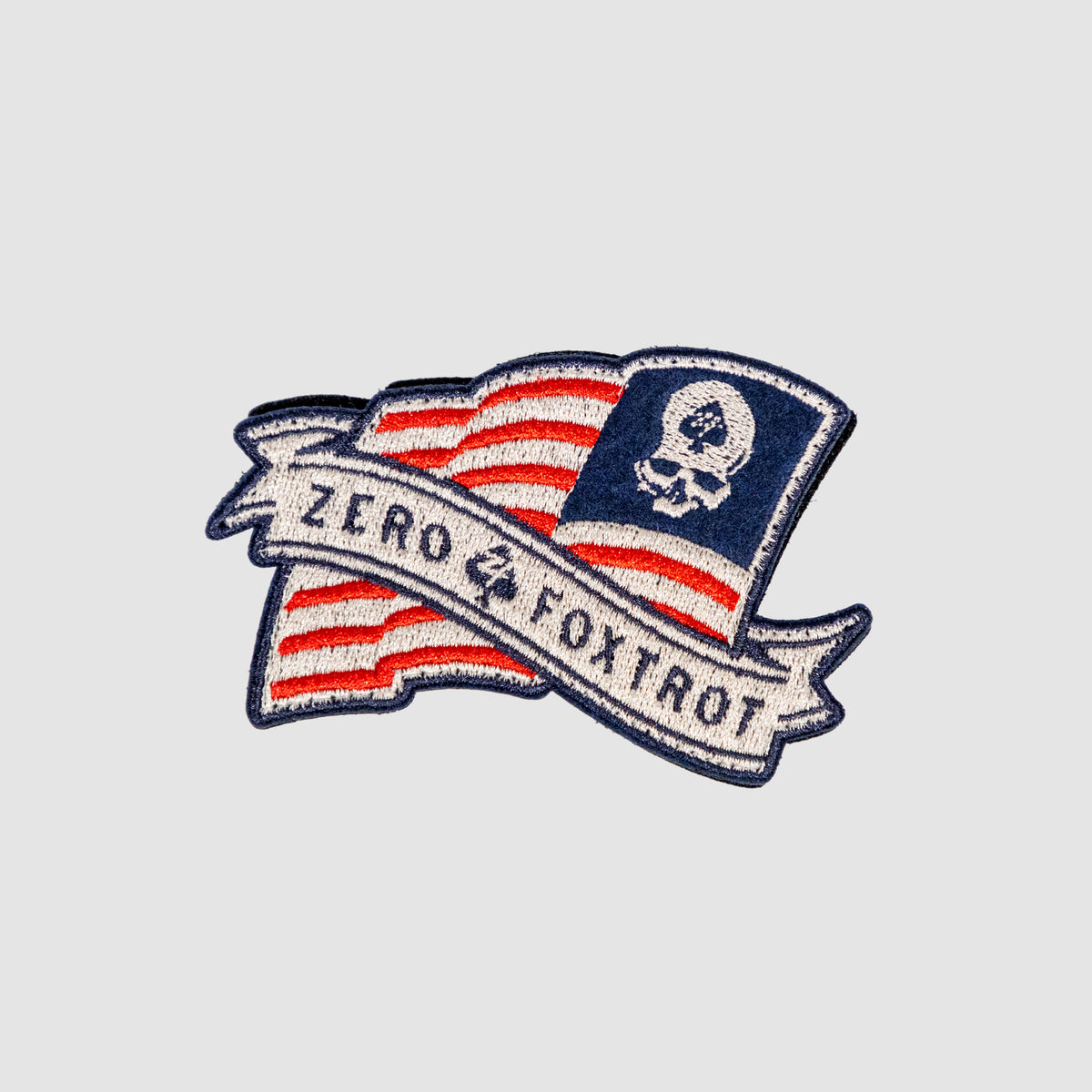 ZF Flag Logo Patch featuring a red, white, and blue flag design, skull emblem, and banner reading Zero and Control in embroidered detail