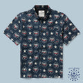 Navy blue short-sleeve button-up Surf Shirts featuring a patriotic pattern with stars, the year 1776, and red, white, and blue eagle motifs.
