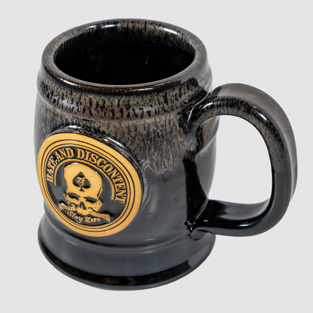 Zero Dark Mug with a glossy black and dark brown gradient finish featuring a gold emblem of a skull and the words "Ruthless and Discontent" on the front.