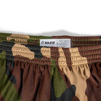 Close-up of the waistband and fabric pattern of ZF Silkies - Camos, featuring woodland camouflage colors including green, brown, tan, and black with an elastic waistband and care label.