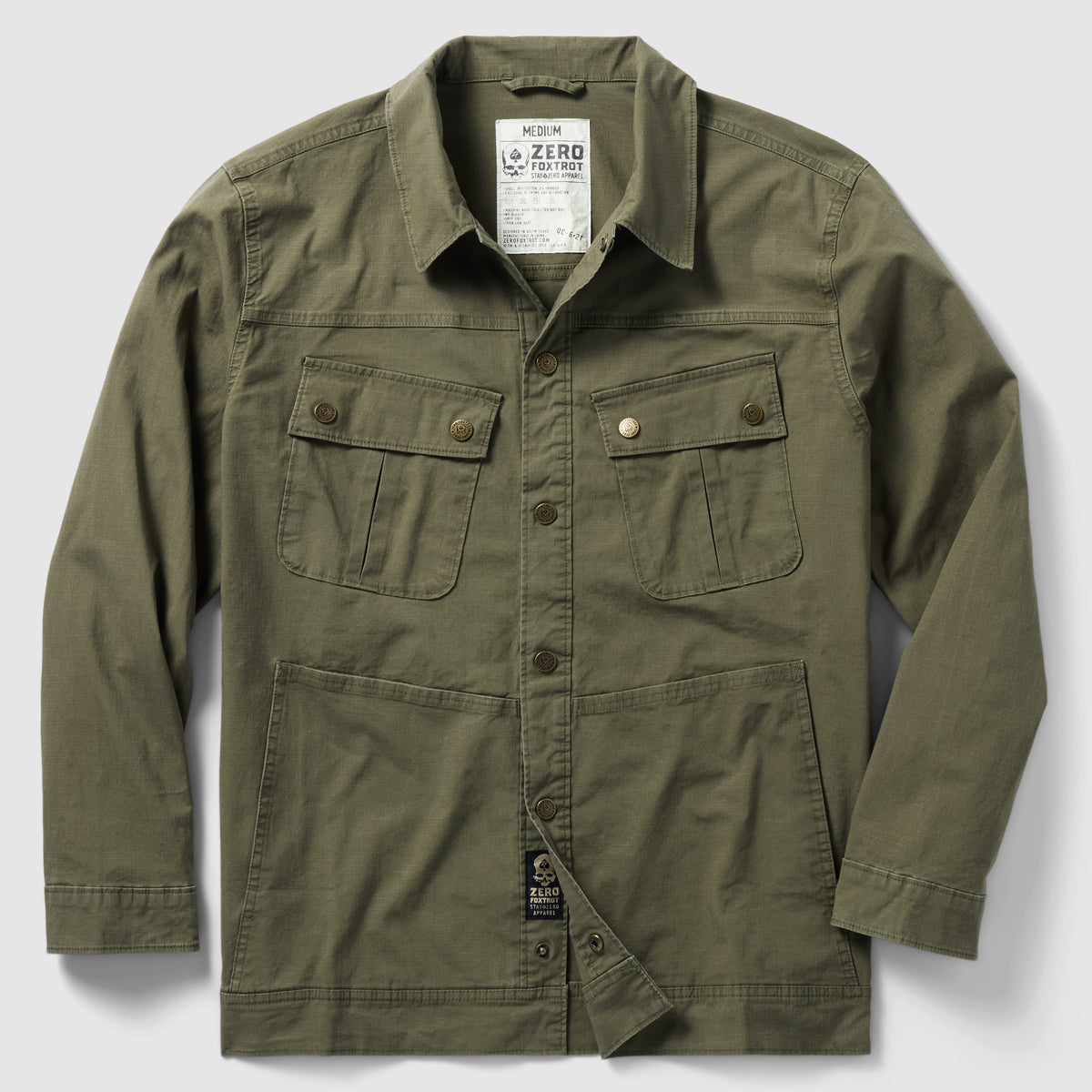 Chore Jacket in dark olive with button-front closure, four front pockets including two chest flap pockets, designed for durable and stylish outerwear.