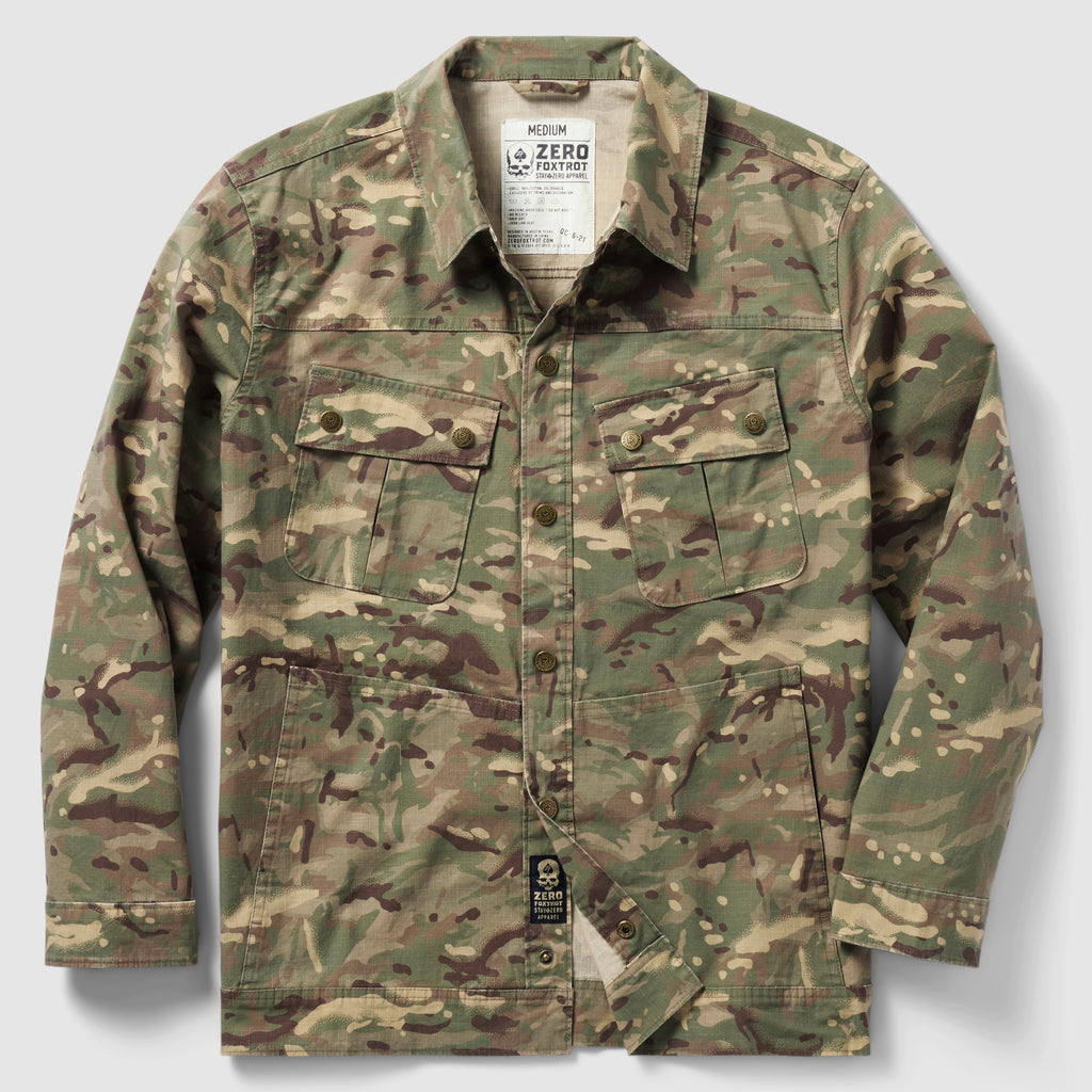 Chore Jacket in camouflage pattern featuring a button-up front, two chest flap pockets with buttons, and two side hand pockets, designed for durable outdoor wear.
