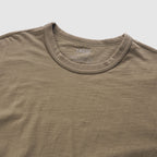 Close-up of a dark brown Cotton Skivvy Tee made from soft cotton fabric, featuring a round neckline and subtle textured detailing.