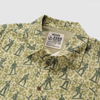 Surf Shirts (Last Chance) with a camouflage pattern featuring illustrated soldiers, button front, collar, chest pocket, and medium size label