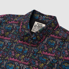 Surf Shirts (Last Chance) black button up shirt with colorful surf, skull, lightning, and Contraband pattern, featuring a collared neckline and chest label