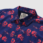 Surf Shirts (Last Chance) navy blue shirt with a button front, collar, chest pocket, and red skull cherry pattern throughout