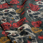 Surf Shirts (Last Chance) with dark fabric patterned with skulls, red roses, and gold accents, showing textured material and buttons