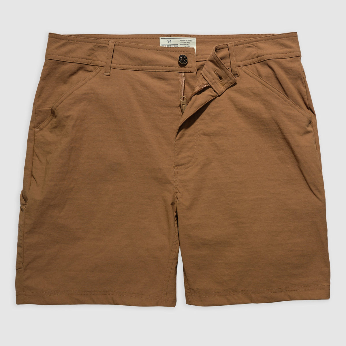 Front view of coyote brown Field Shorts with button and zipper closure, belt loops, and side pockets laid flat on a light background.