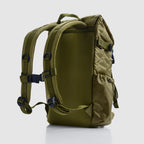 Woobie Backpack in olive green shown from the back with padded adjustable shoulder straps, top handle, and side pockets, designed for comfortable carrying and daily use.