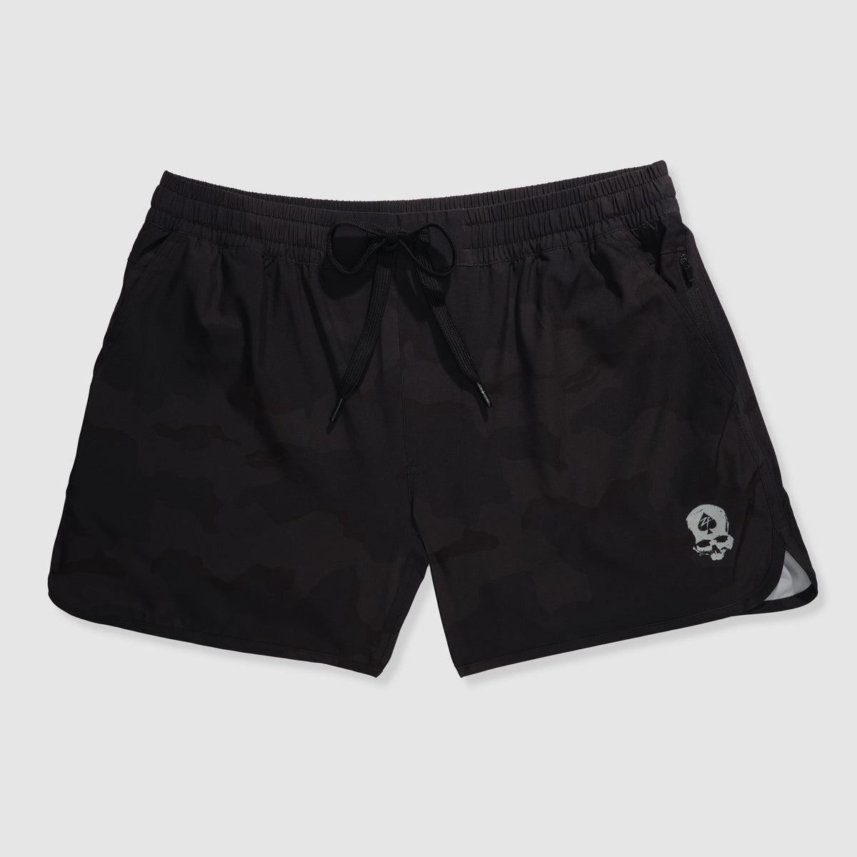 Zero Shorts - 5" Inseam in black desert camo pattern with an elastic waistband, drawstring closure, and a small skull graphic on the lower left leg.