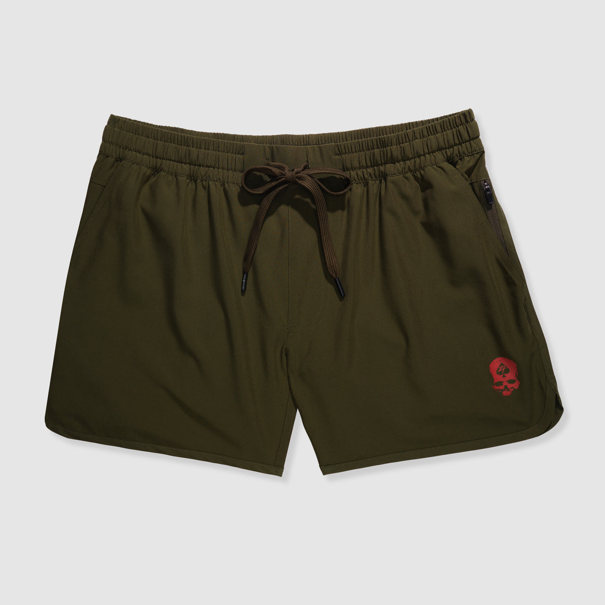 Olive green athletic shorts with an elastic waistband and drawstring, featuring a small red skull logo on the left leg, designed as Zero Shorts - 5" Inseam.