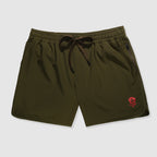 Olive green athletic shorts with an elastic waistband and drawstring, featuring a small red skull logo near the hem and zippered side pockets, Zero Shorts - 7" Inseam.