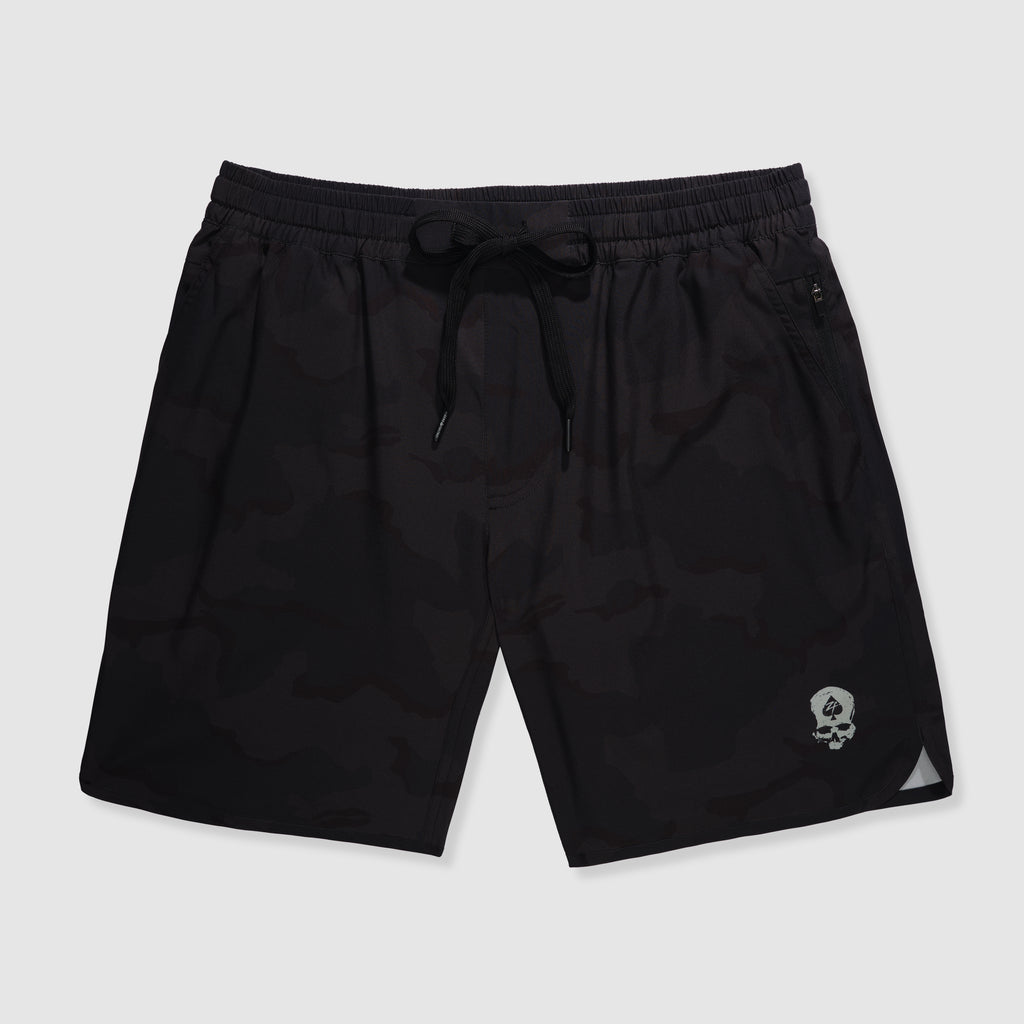 Zero Shorts - 9" Inseam in black desert camo pattern featuring an elastic waistband with drawstring and a small skull logo near the hem for casual and athletic wear.