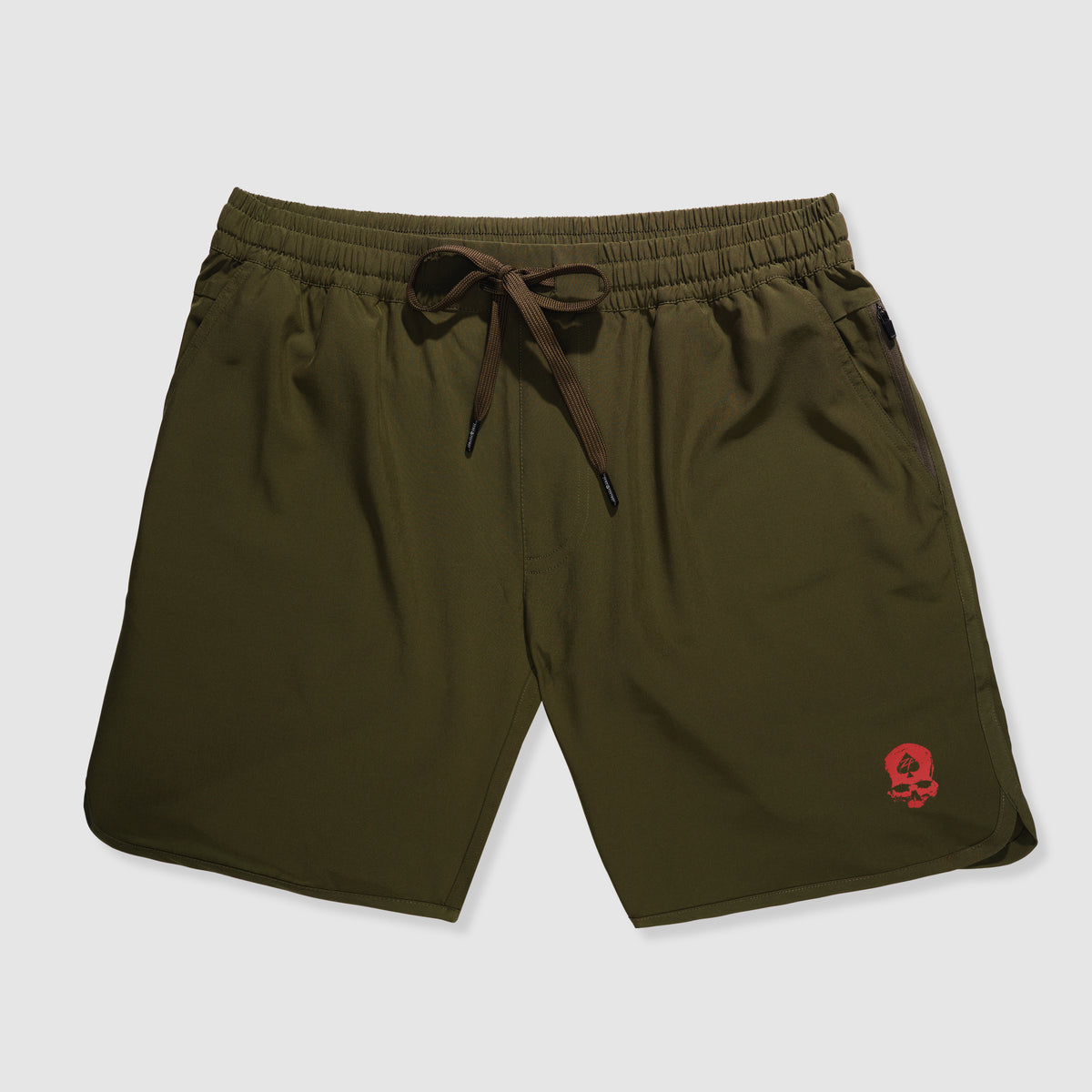 Olive green lightweight shorts with elastic waistband and drawstring, featuring a small red skull logo near the bottom hem, Zero Shorts - 9" Inseam.