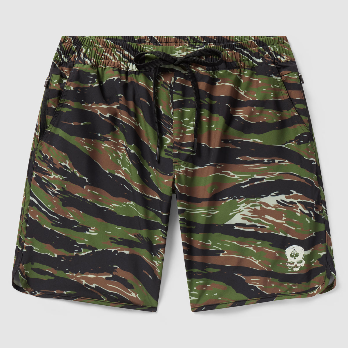 Zero Shorts - 9" Inseam featuring a green, brown, and black camouflage pattern with an elastic waistband, black drawstring, and a small white skull logo on the hem.