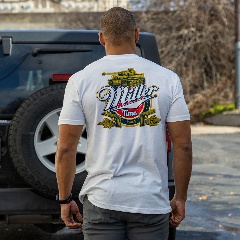 FUBAR Tee shown from the back on a person wearing a white shirt with a colorful Miller Time graphic and vintage tank illustration