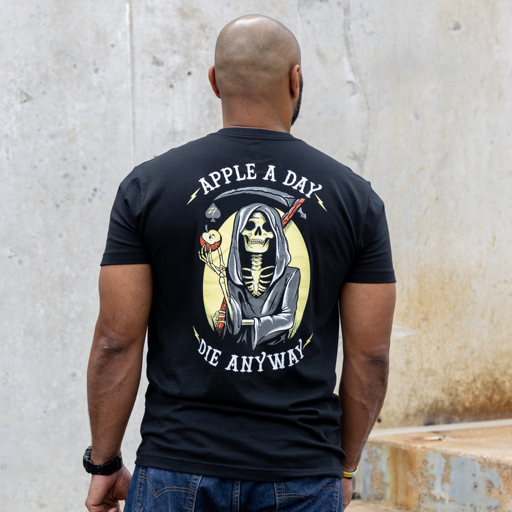 Apple a Day Tee black graphic T shirt shown from the back with a hooded skeleton holding a flower and the words Apple a Day Die Anyway